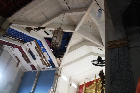 Damaged roof and ceiling.