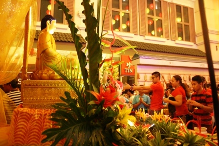 Paying their respects to the image of Buddha.