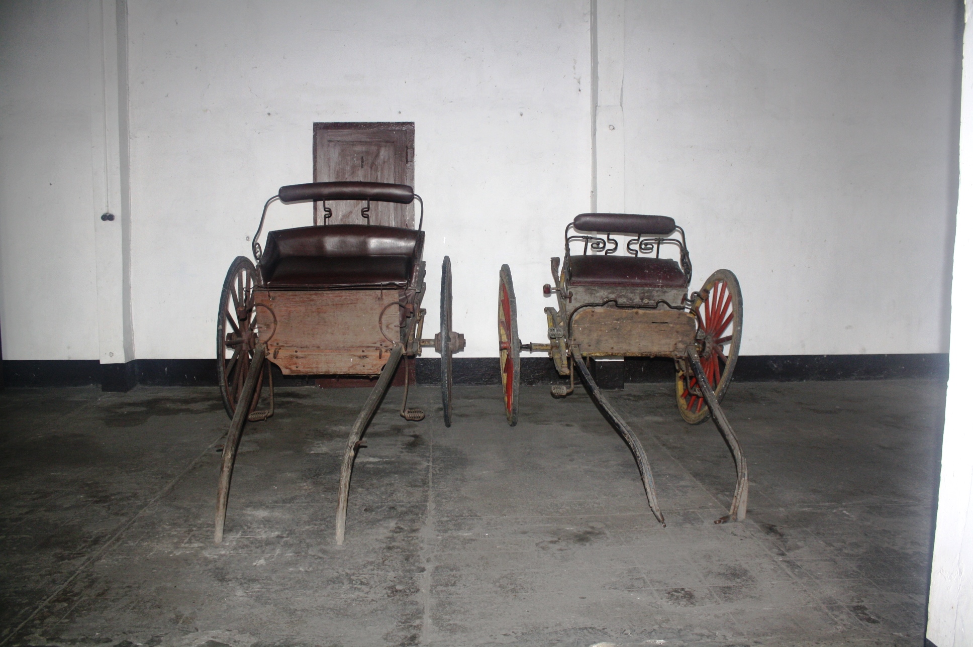 The carriages parked at the ground floor of the house.