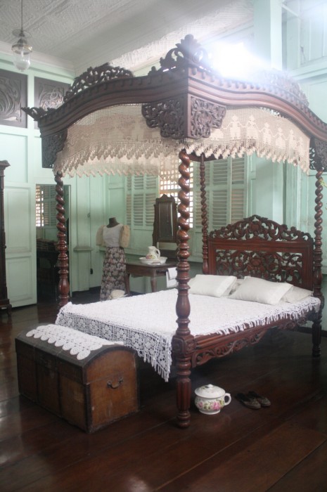 The four-post bed with canopy.