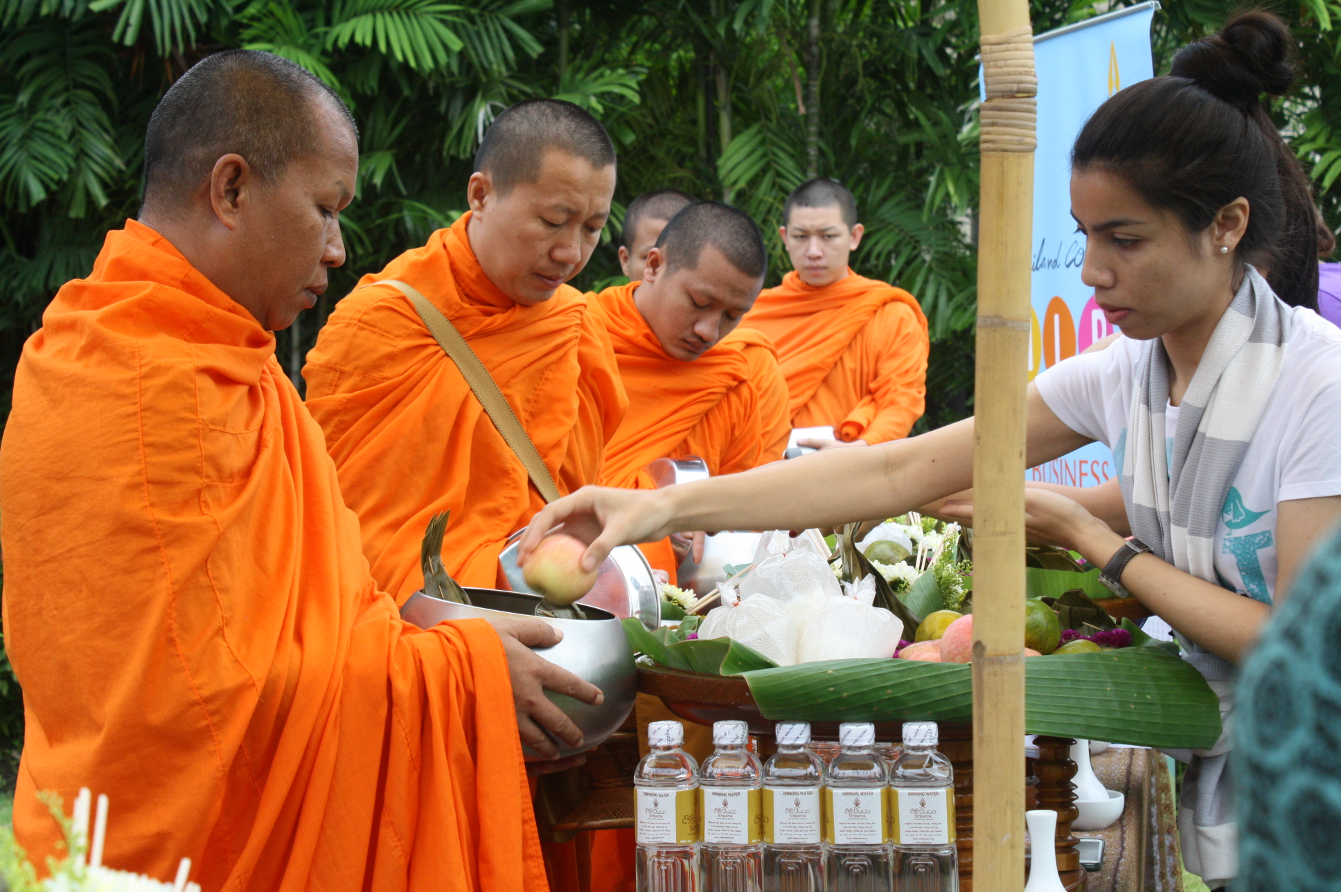 The alms offering ceremony has begun.