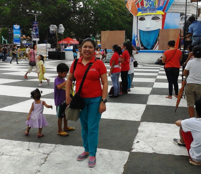 Standing and waiting at the Bacolod Public Plaza for the street dance competition to begin.
