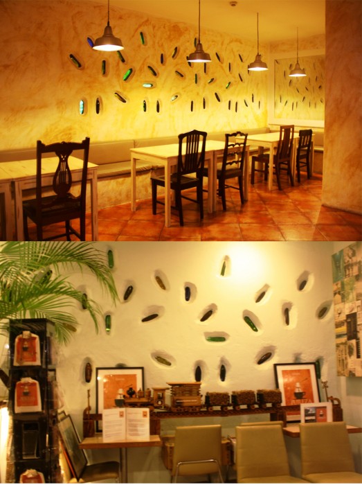 Separated by bottles. The upper photo is the Trattoria Uma portion while the lower photo is taken inside Cafe Uma.