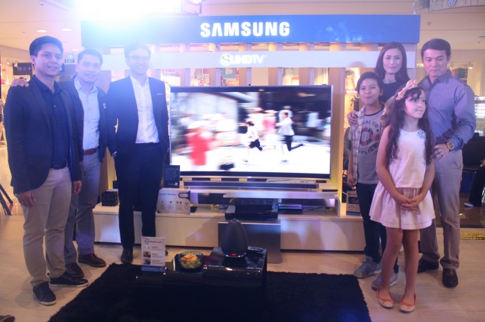Samsung executives with the model family.